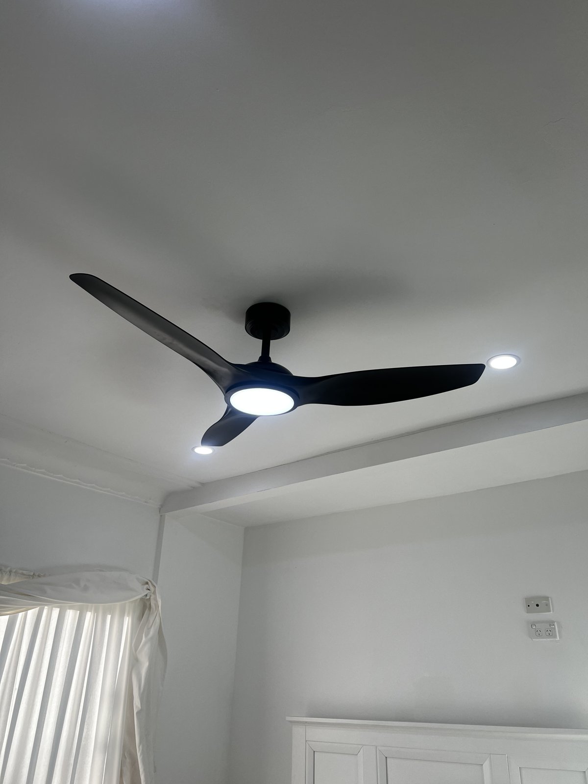New black ceiling fan neatly installed